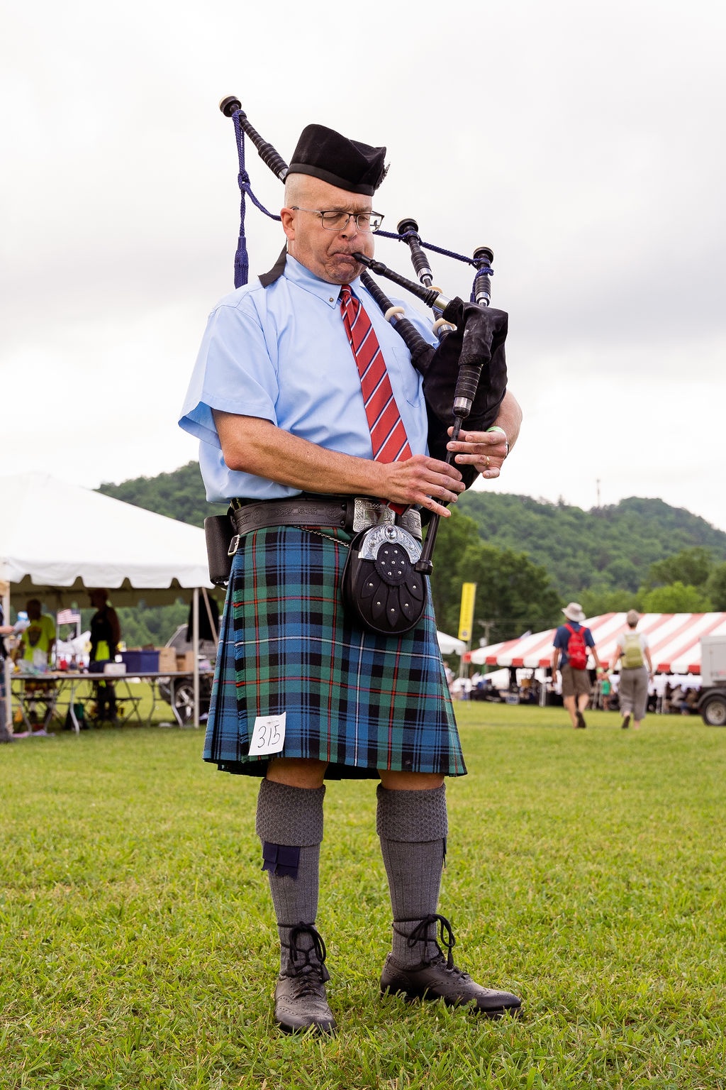 bagpiper playing in Scottish festival competition