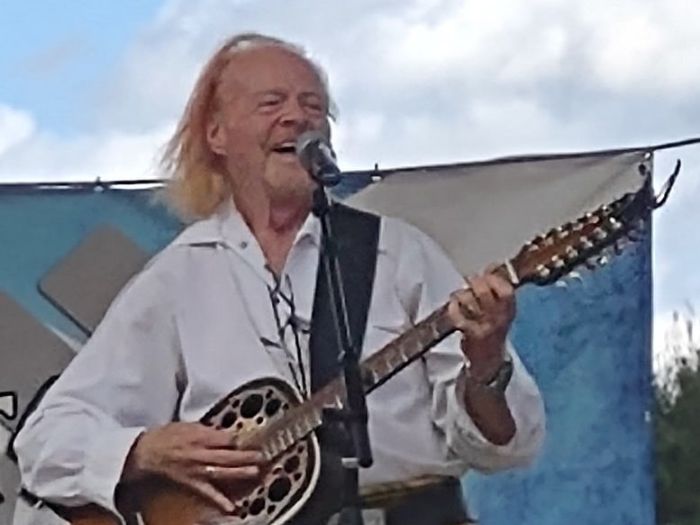Red McWilliams playing a guitar on stage