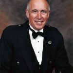 Image of white man in tux.